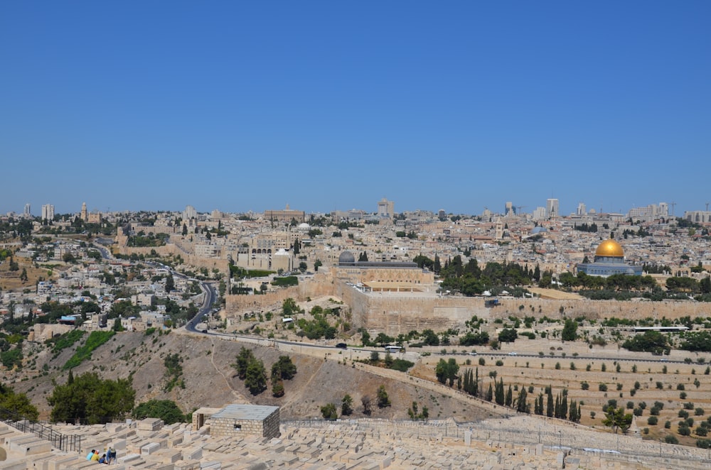 a view of a city from a hill