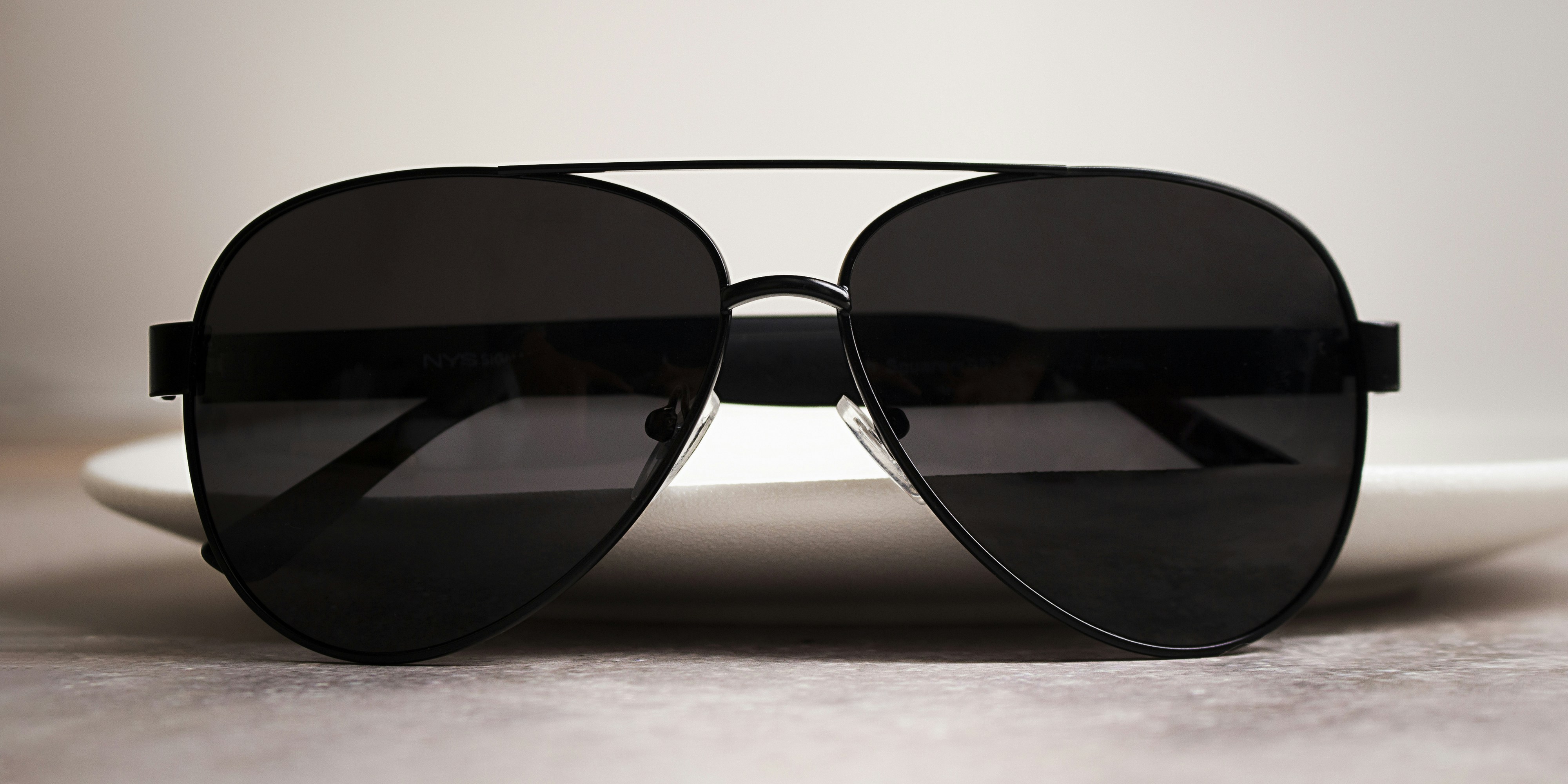a pair of sunglasses sitting on top of a table
