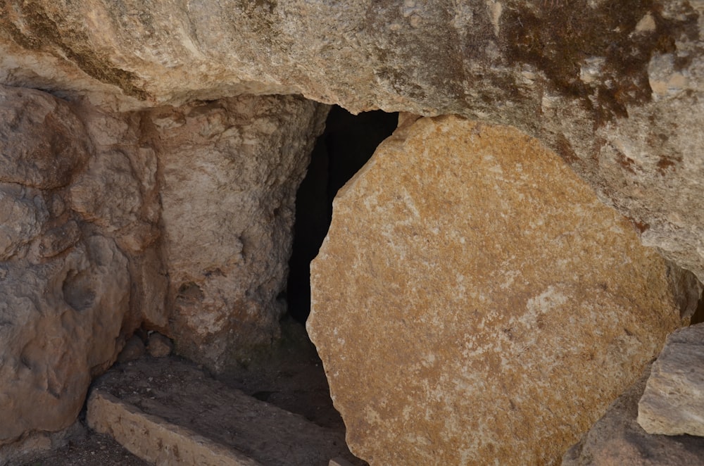 a large rock with a small hole in it