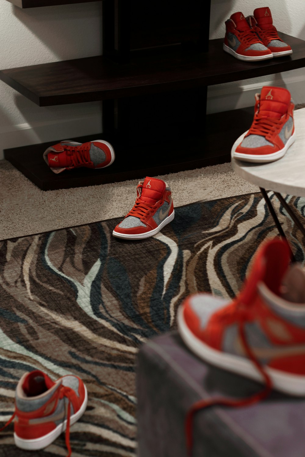 a couple of red shoes sitting on top of a rug