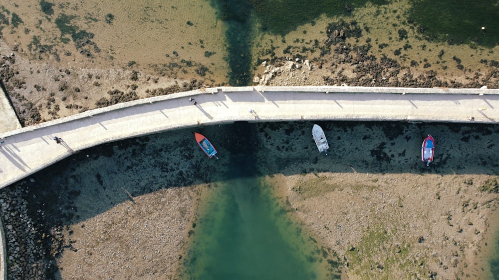 a bridge over a body of water with boats on it