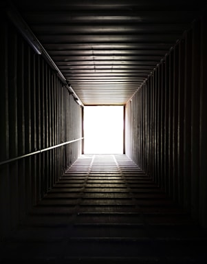 a dark tunnel with a light at the end