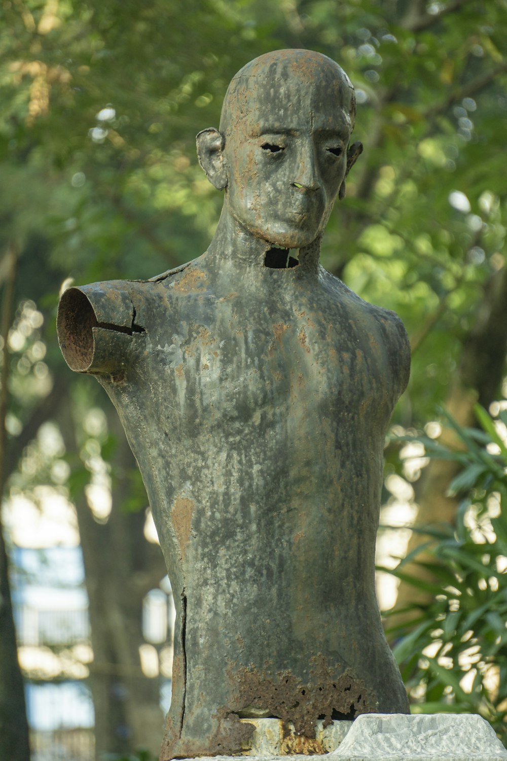 a statue of a man with a pipe in his mouth