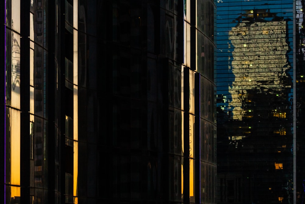 a city street with tall buildings in the background