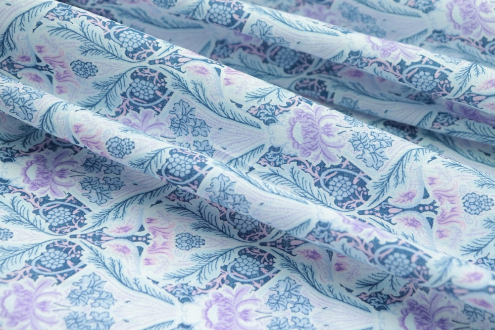a close up of a blue and purple fabric