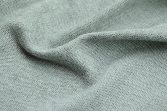 Close-up of soft green fabric textures highlighting the quality and detail of verdeviva's women's apparel.