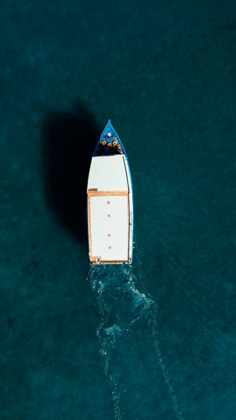 a small boat floating on top of a body of water