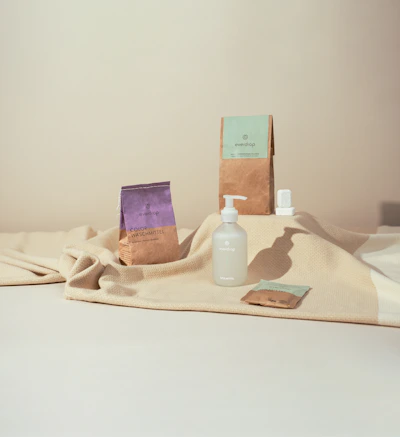 Close-up of eco-friendly detergent packaging with fresh lemon and lavender accents.
