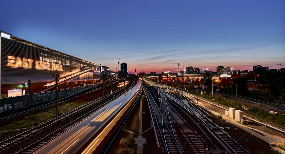 a train station with a train on the tracks