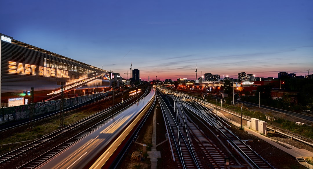 a train station with a train on the tracks,