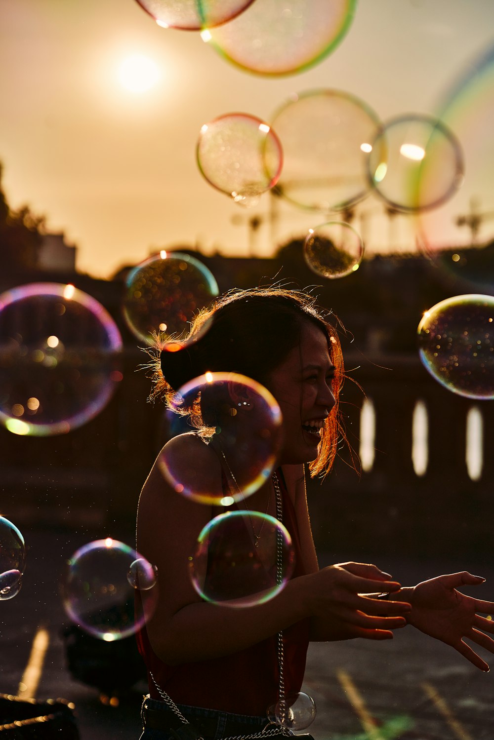 a woman is blowing bubbles in the air