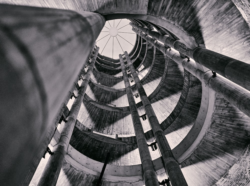 a black and white photo of a spiral staircase