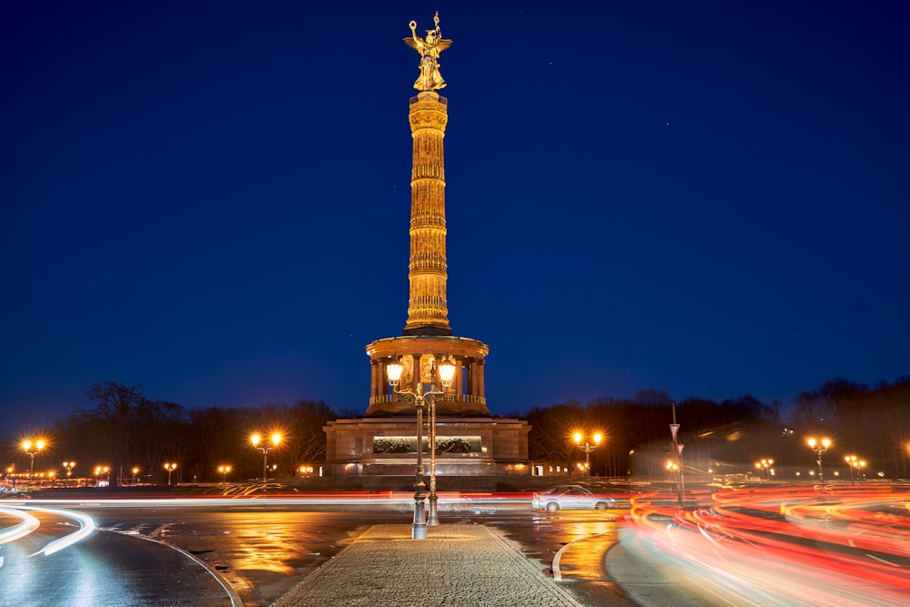 a very tall monument with a statue on top of it