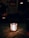 A dark, atmospheric room adorned with gothic decor and candles.