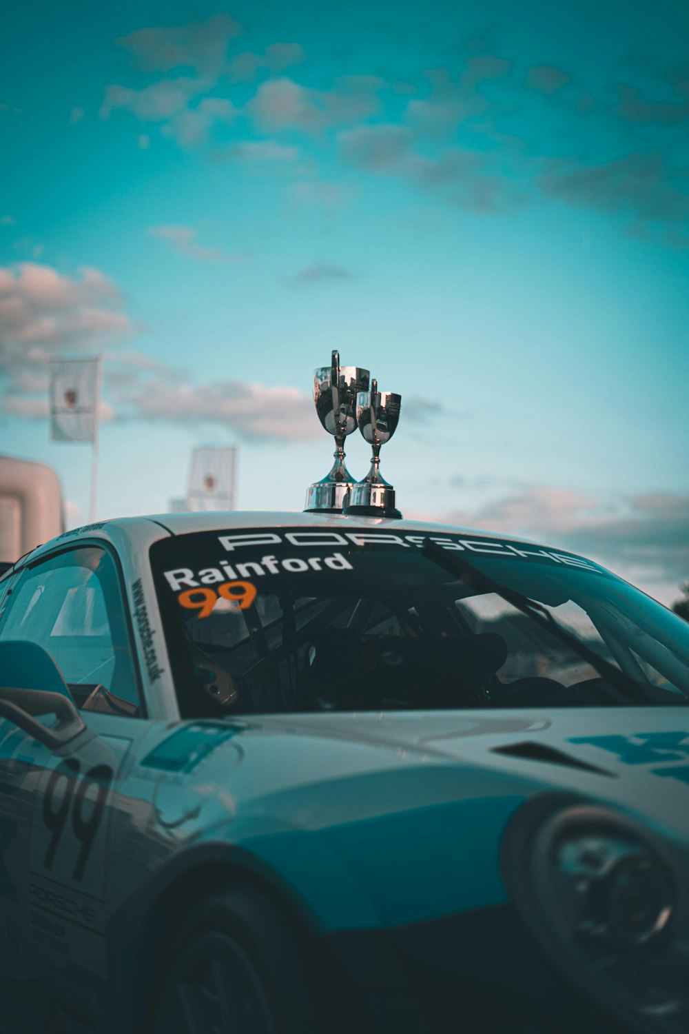 a car with a trophy on top of it