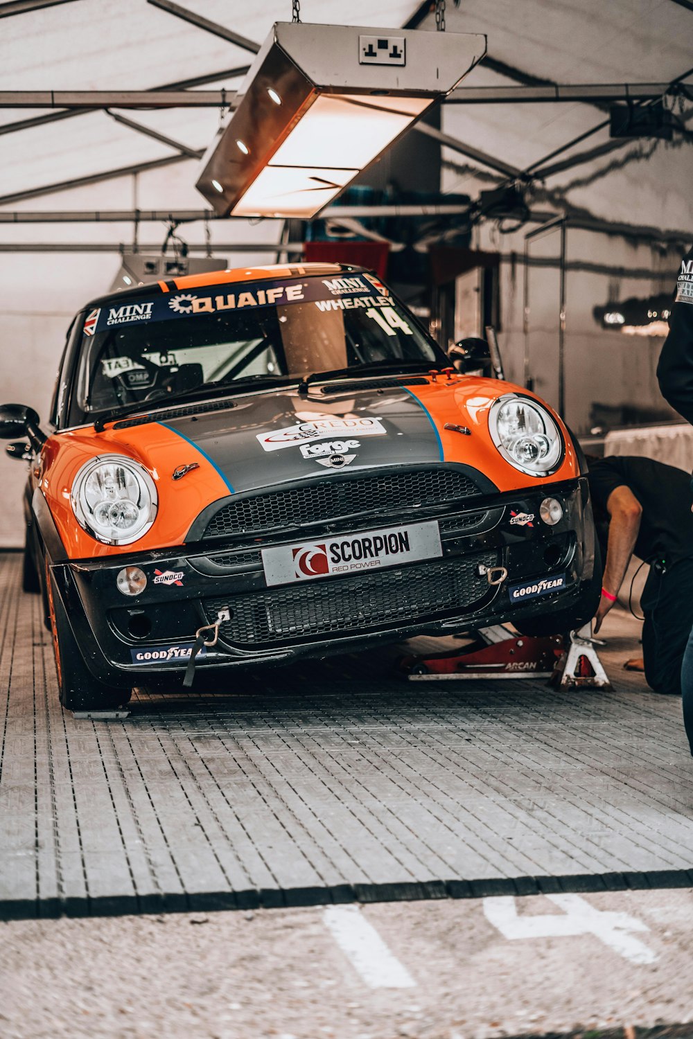 a man working on a car in a garage