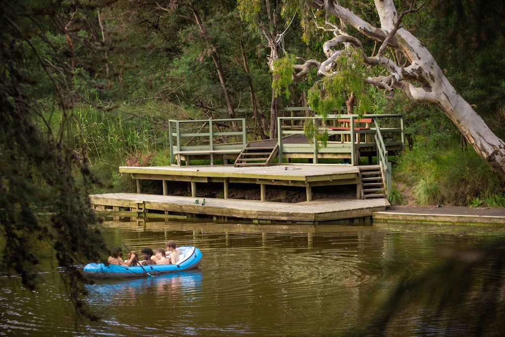 a couple of people floating on top of a body of water