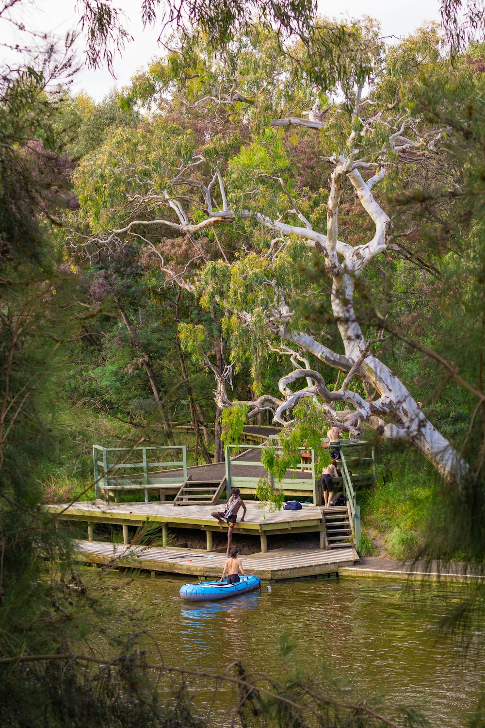 a man standing on a paddle board in the water