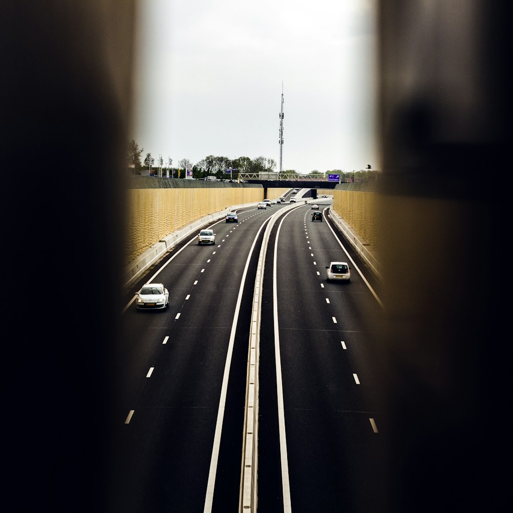 a view of a highway from inside a tunnel