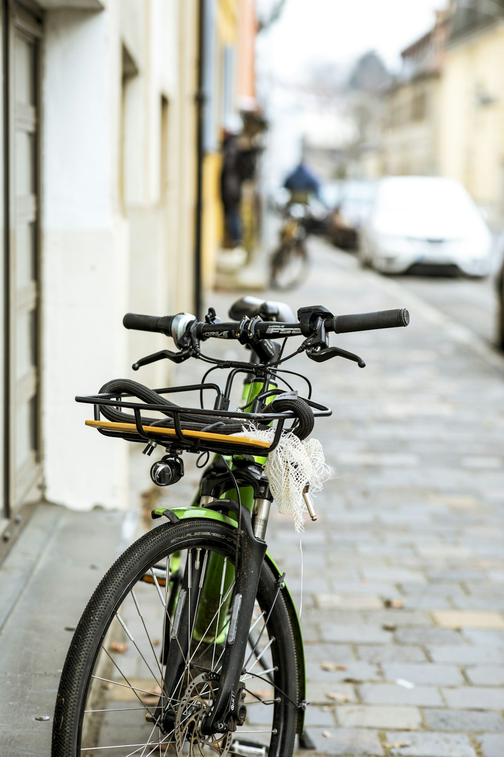 a bicycle parked on the side of a street