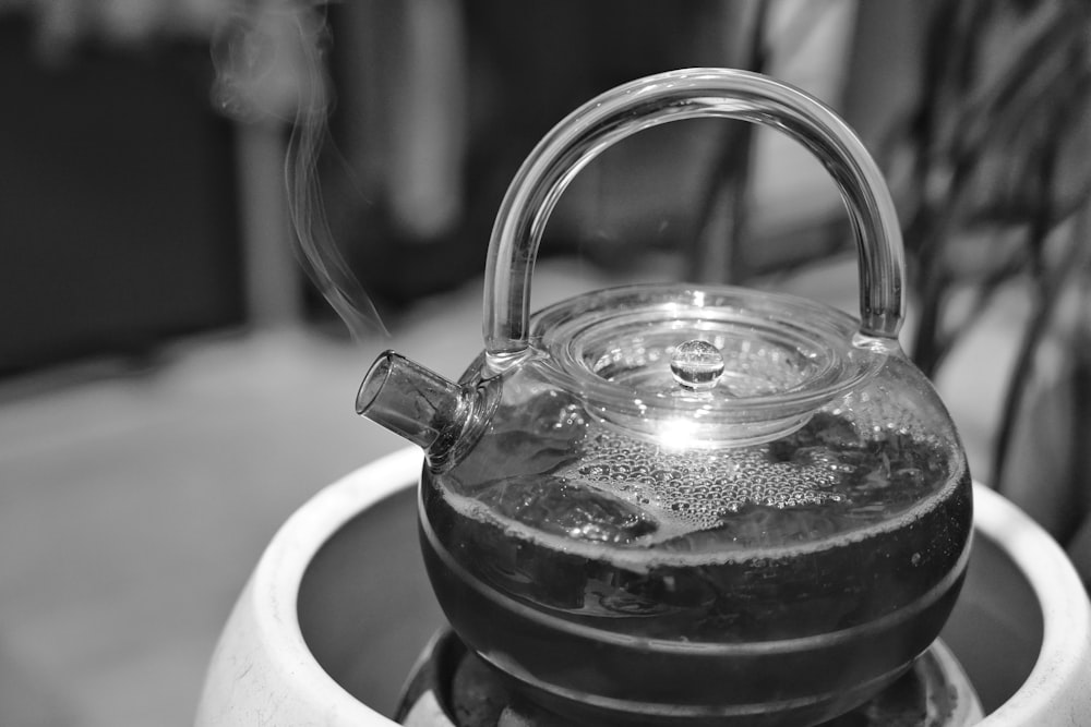 a tea kettle with a liquid inside of it