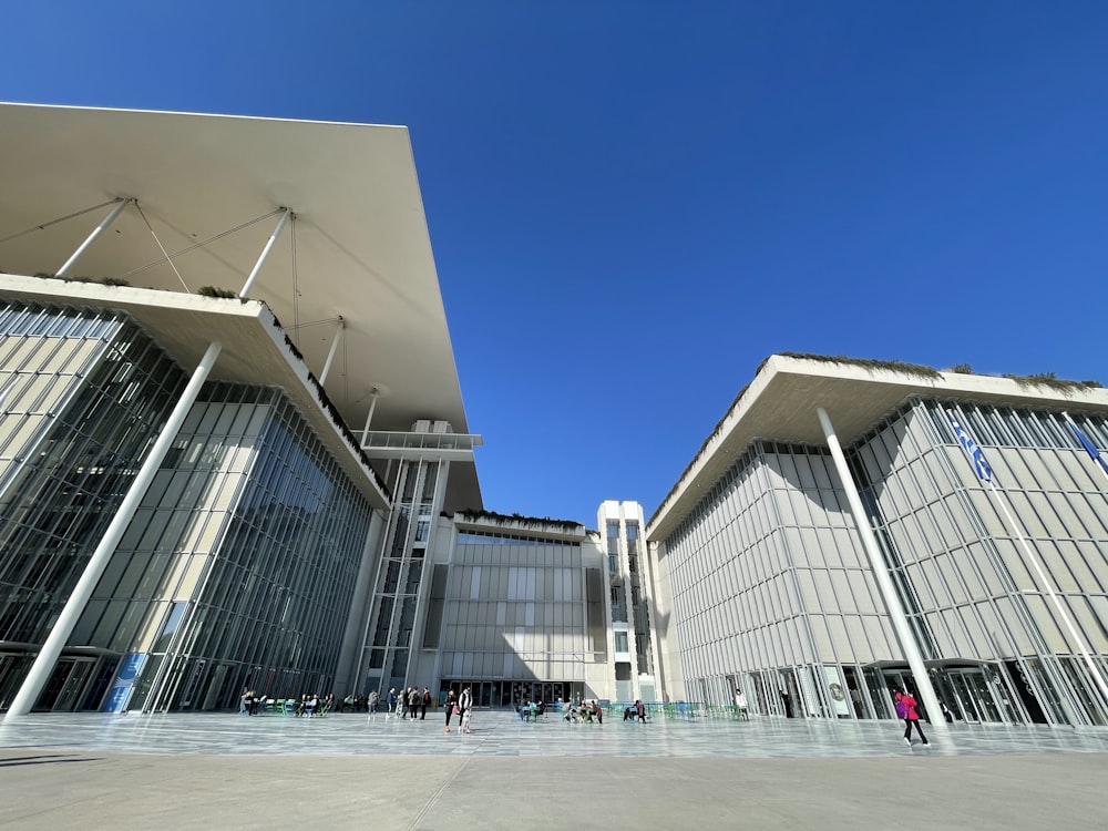 a large building with a lot of windows and a sky background