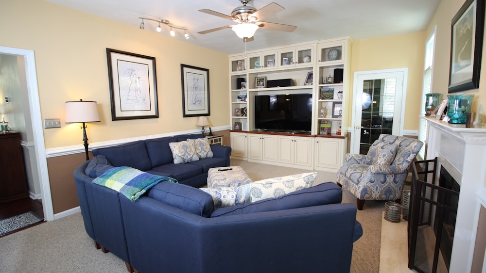 a living room filled with furniture and a fire place