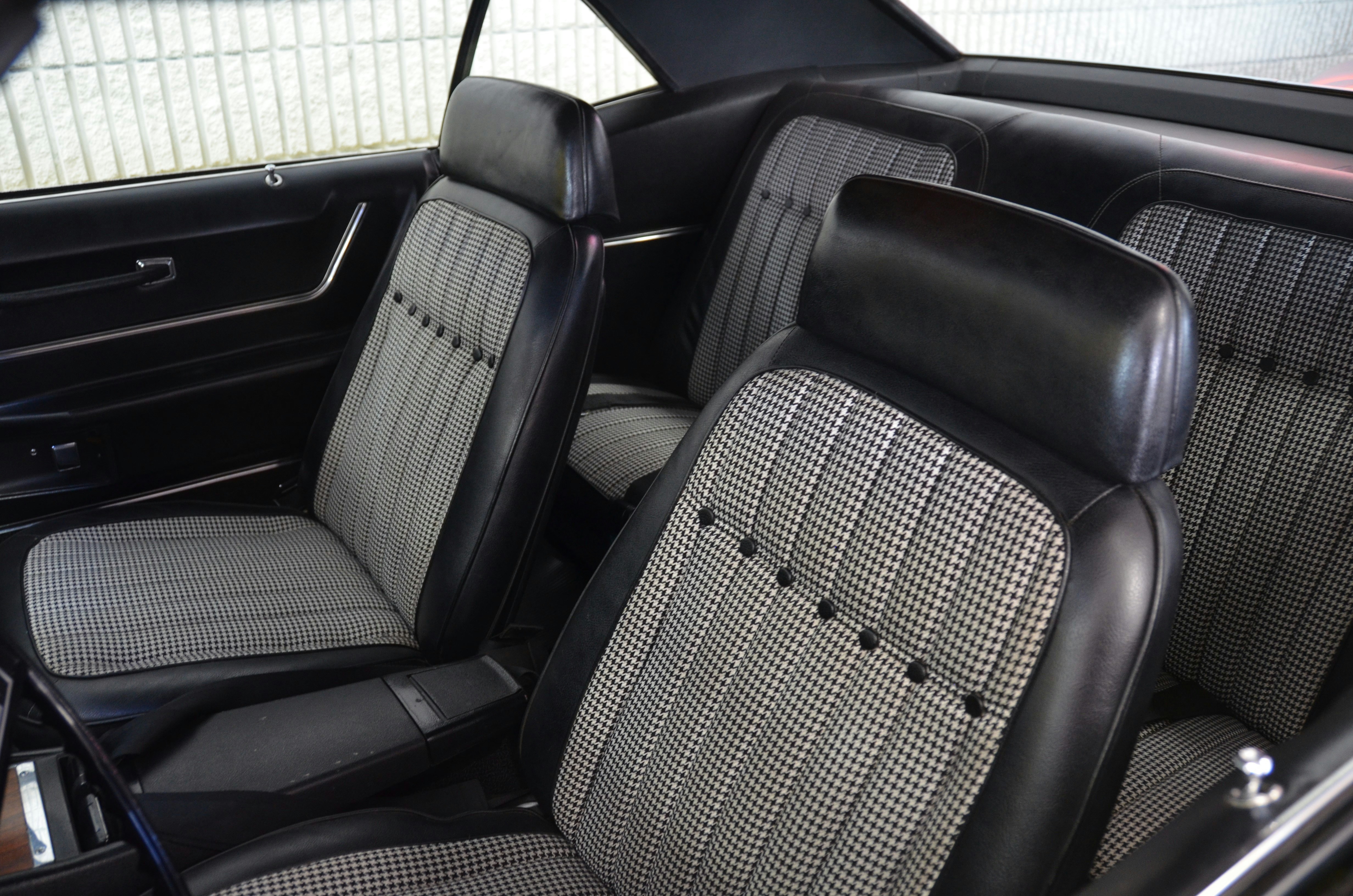 Luxury electric car interior with leather seats and wide digital dashboard