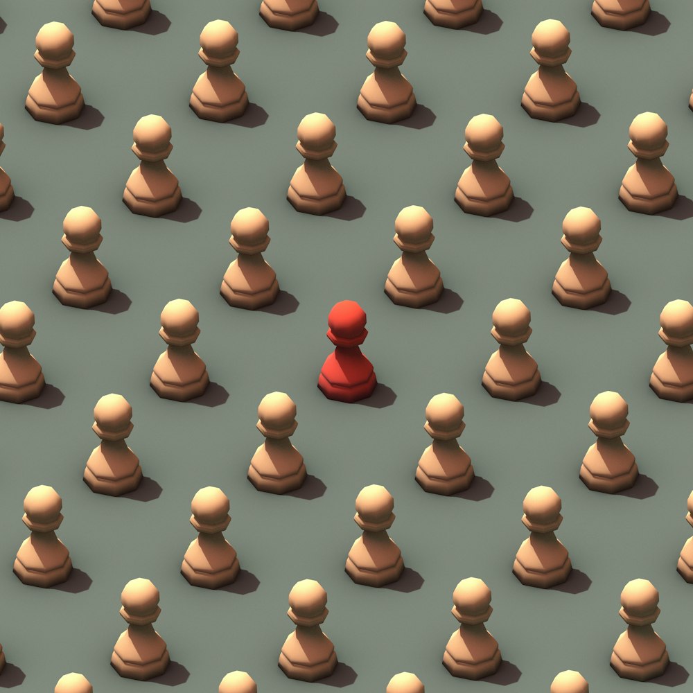 An array of beige coloured chess pawns, with one red piece in the middle