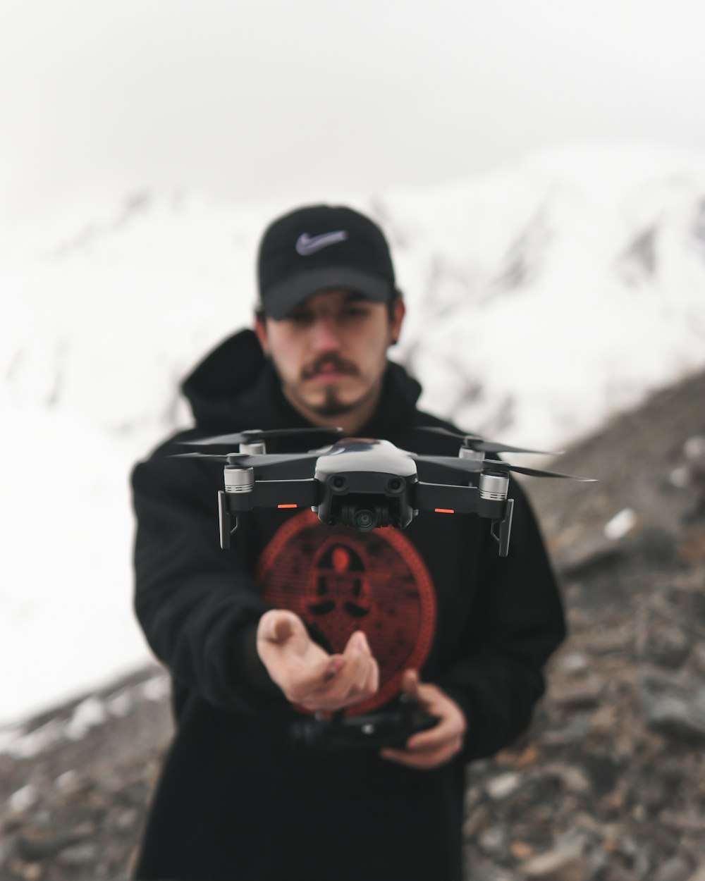 a man holding a red object in his hands