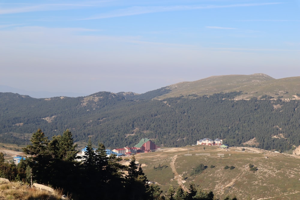 a view of a mountain range with a village in the distance