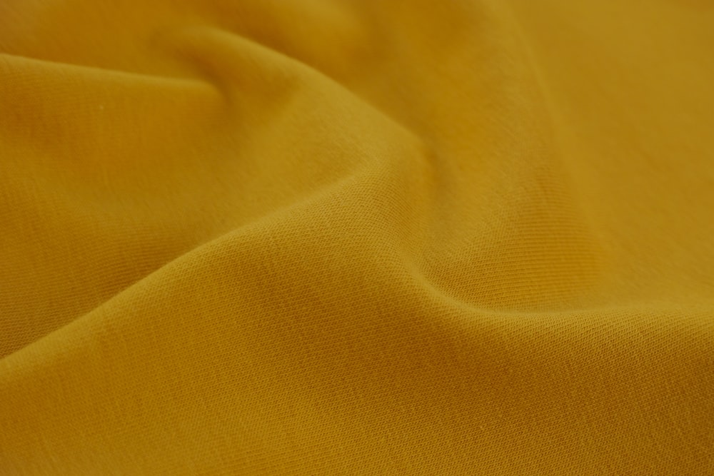 a close up view of a yellow fabric