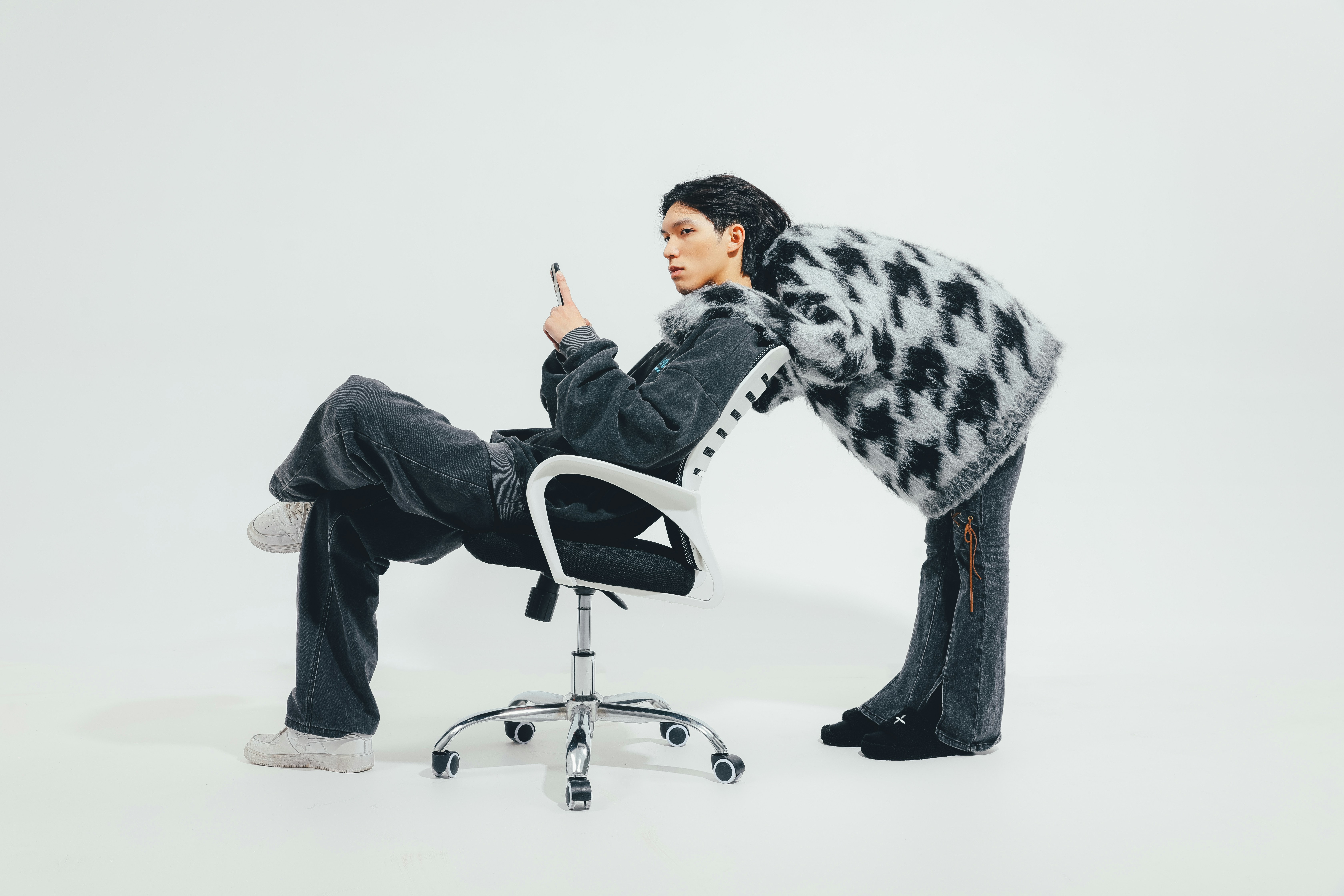 Woman sitting with proper posture using phone