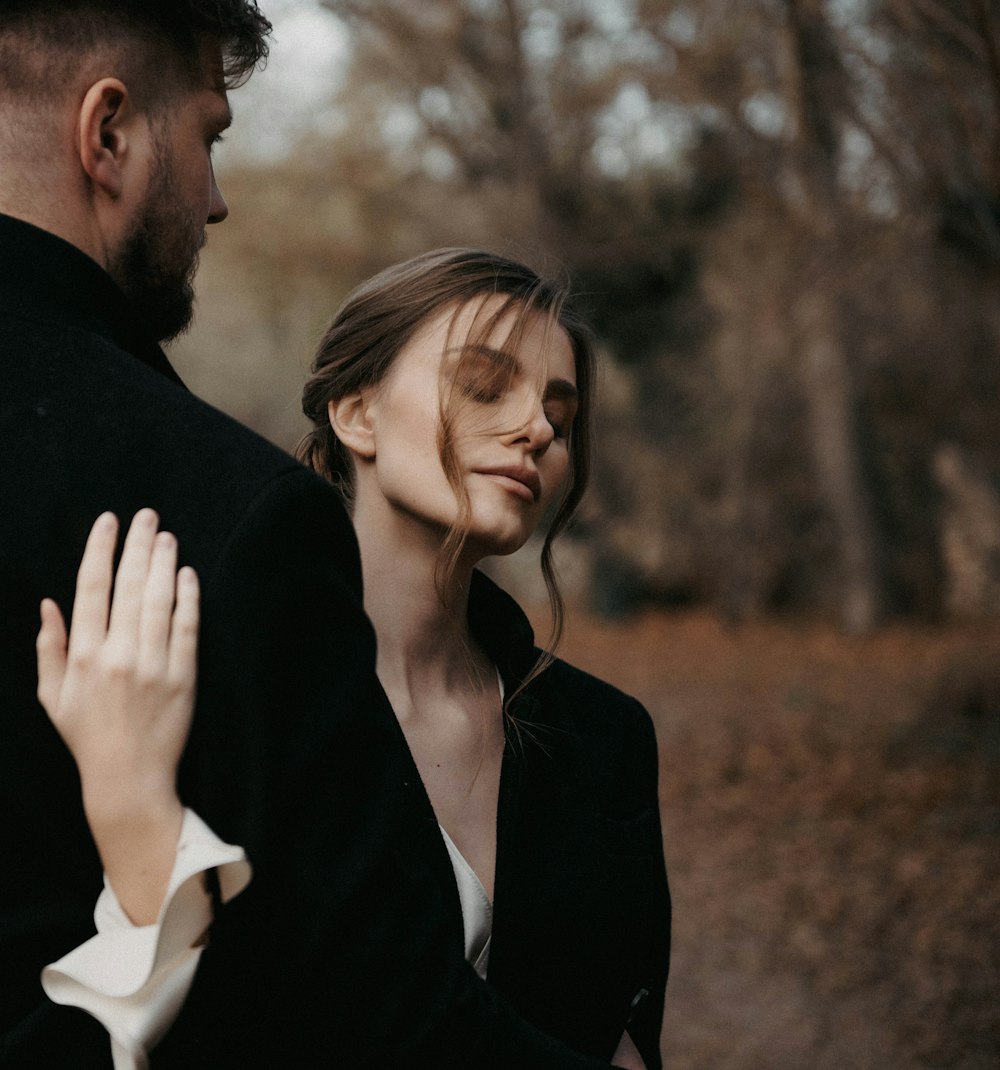 a man and a woman standing next to each other