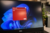 laptop computer with a red malicious file warning malware