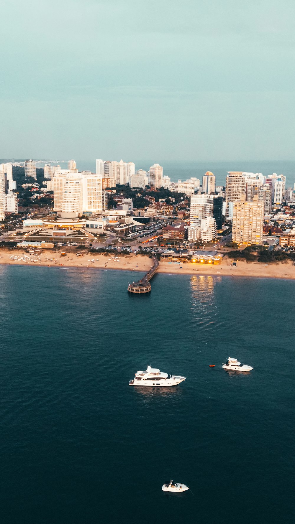 a group of boats floating on top of a body of water