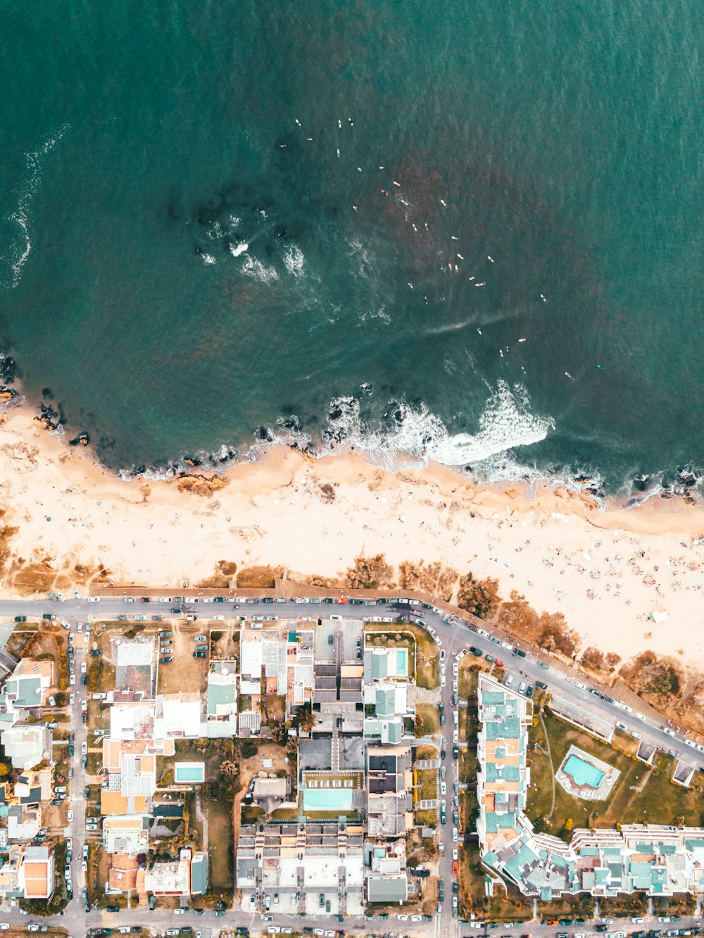 an aerial view of a beach and a city