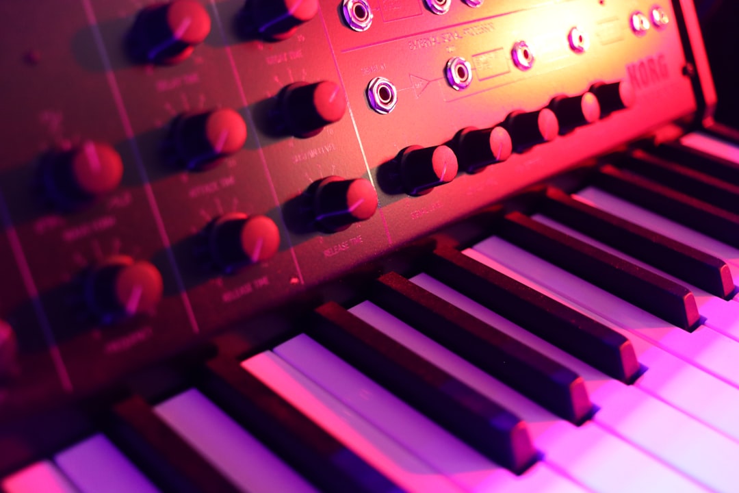 a close up of a keyboard with many knobs