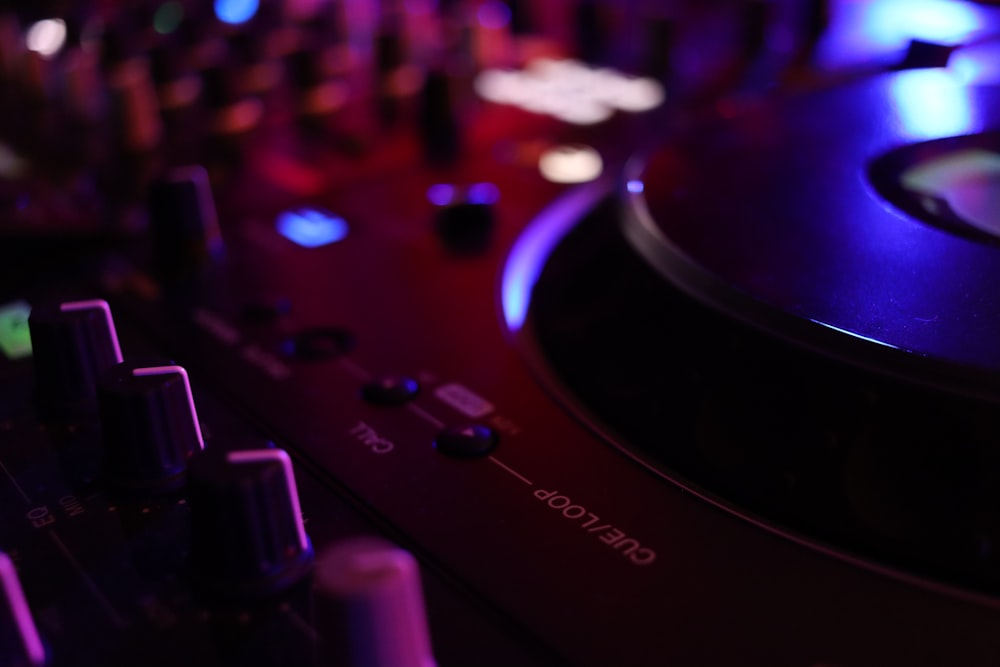 a close up of a dj's turntable in a dark room