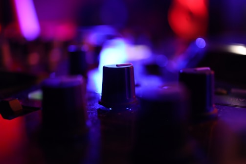 Close-up of a high-quality audio mixer with colorful knobs