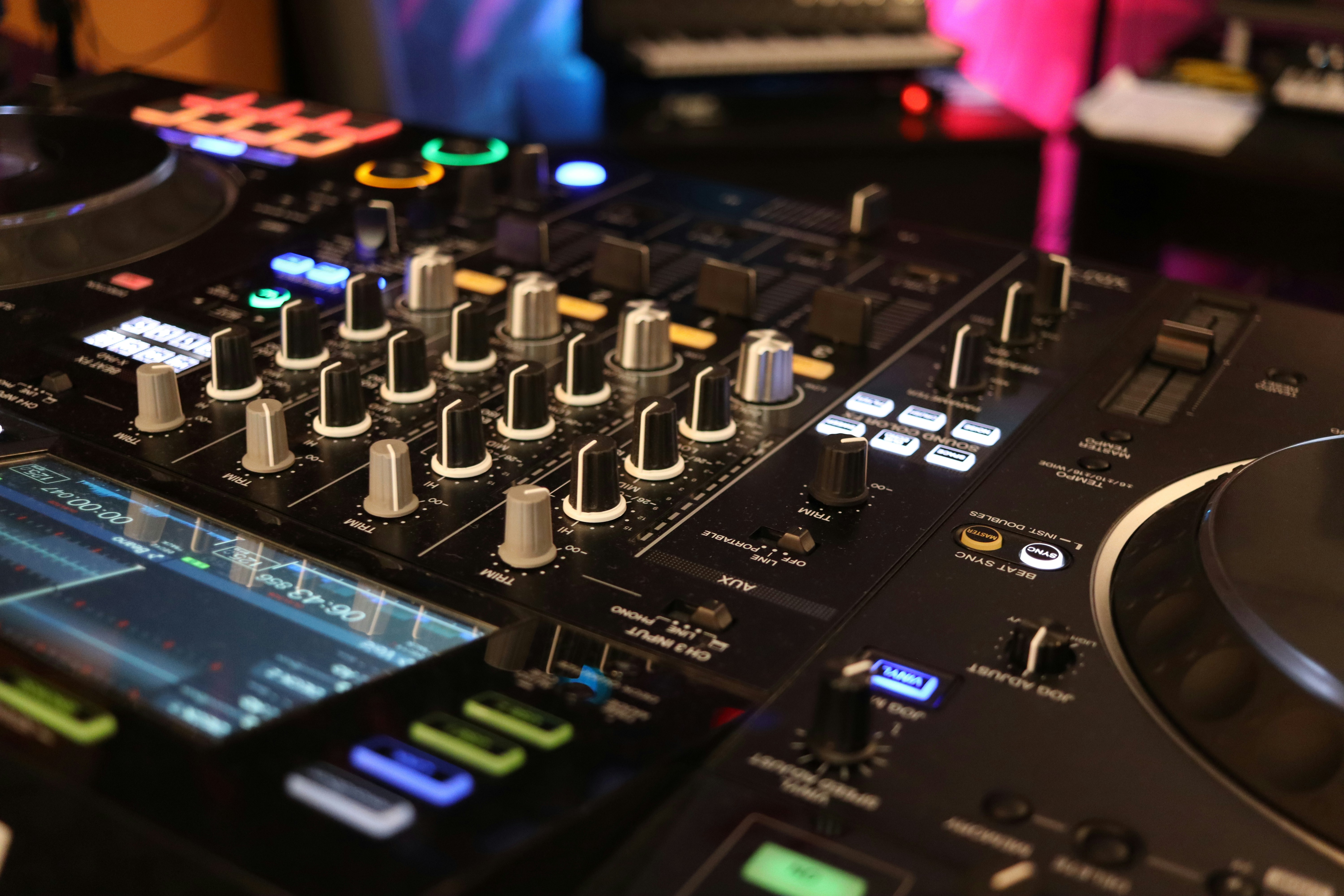 a close up of a dj's control board