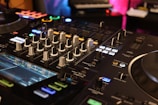 a close up of a dj's control board