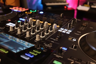 a close up of a dj's control board