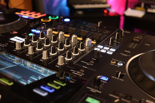 a close up of a dj's control board