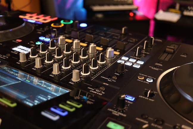 a close up of a dj's control board