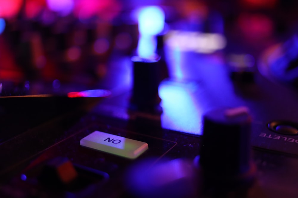 a close up of a dj's turntable with a blurry background