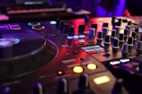 a close up of a dj's control board