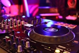 a close up of a dj's turntable in a nightclub