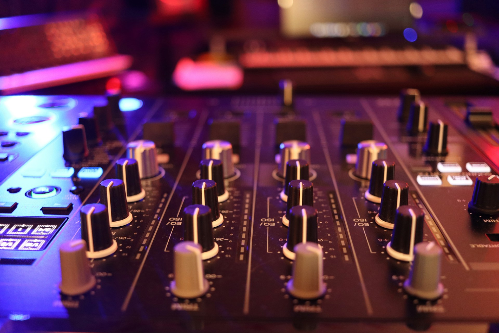 a close up of a sound board in a recording studio