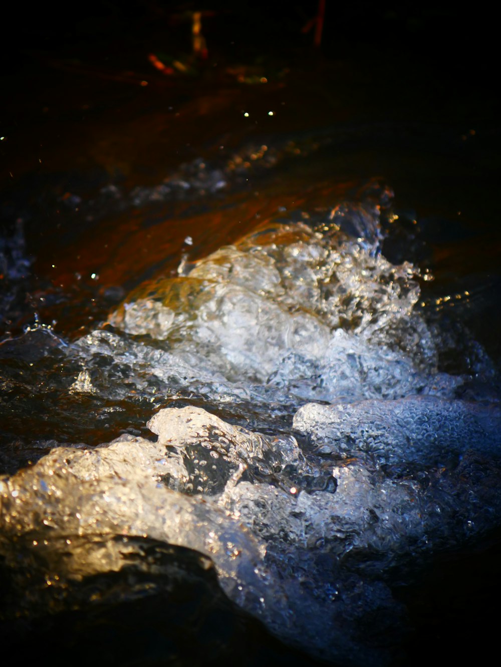 a close up of a rock in the water